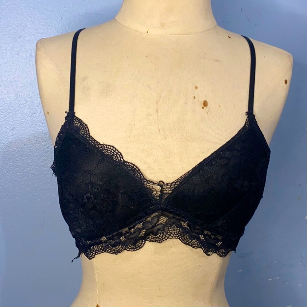 Out from under black lacy bralette